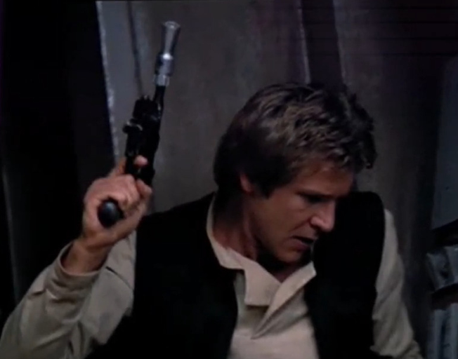 Han Solo holding his blaster pistol