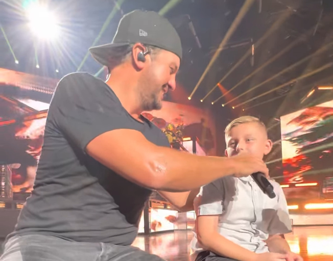 Luke Bryan singing with 10-year-old Brandon on stage in Las Vegas 09-04-22